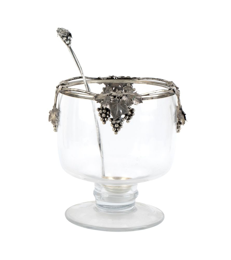 CESA Glass and silver Italian punch bowl: composed of a circular glass bowl, set within a silver frame embellished with vine leaves and hanging bunches of grapes arranged around the rim. The set includes a long serving ladle, featuring a