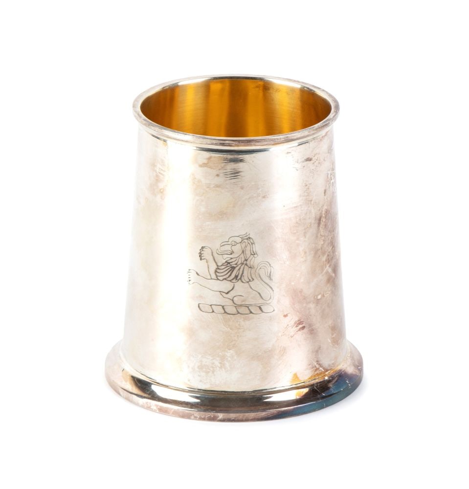 CARMELO GANCI Italian solid silver mug: slightly truncated conical in shape, with an outward-curving, moulded upper rim. It rests on a broad, solid, stepped circular base. The interior of the bowl is made entirely of vermeil. On the front