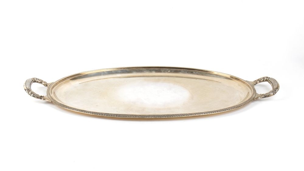 FRATELLI LEONE Italian solid silver tray: oval in shape, characterised by elegant craftsmanship in the neoclassical style. The rim is framed by a refined godron pattern, finely chiselled with small palmette motifs running all the way round