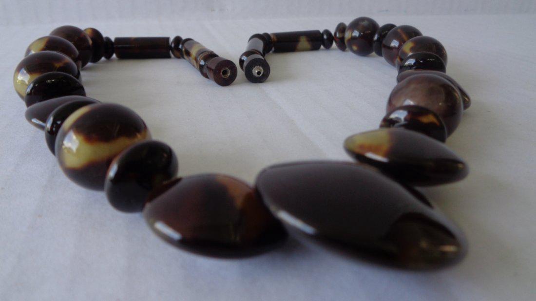 Genuine Natural Caribbean Tortoise: Genuine All Natural Caribbean Tortoise Shell Necklace,Size:20" Long. Weight: 35 gms. Graduated beads are 3/8 - 3/4 up to 1"1/4. Beads are round and round concave. this is real beautiful hand made piec
