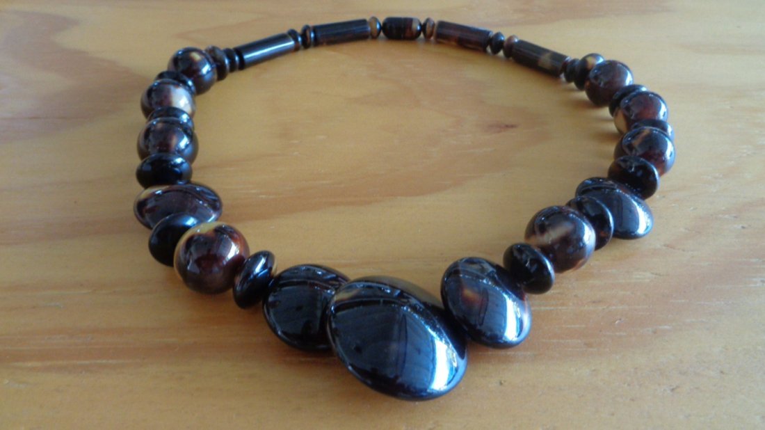 Genuine Natural Caribbean Tortoise: Genuine All Natural Caribbean Tortoise Shell Necklace,Size:20" Long. Weight: 35 gms. Graduated beads are 3/8 - 3/4 up to 1"1/4. Beads are round and round concave. this is real beautiful hand made piec