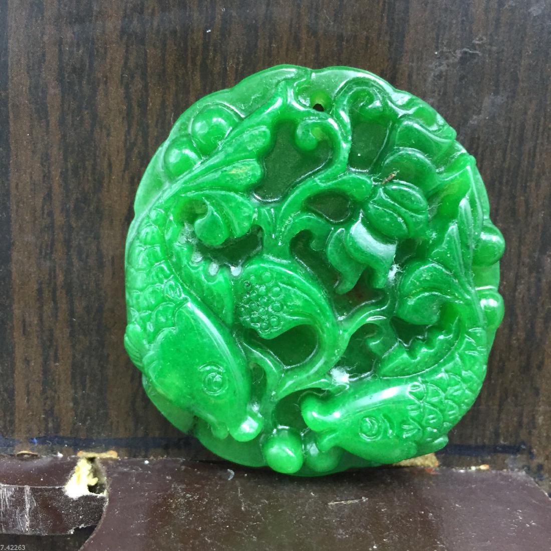 Chinese Hand-carved Green Jadeite jade medallion.Height: Chinese Hand-carved Green Jadeite jade medallion.Height:52mm x Width:47mm x Depth:11mm