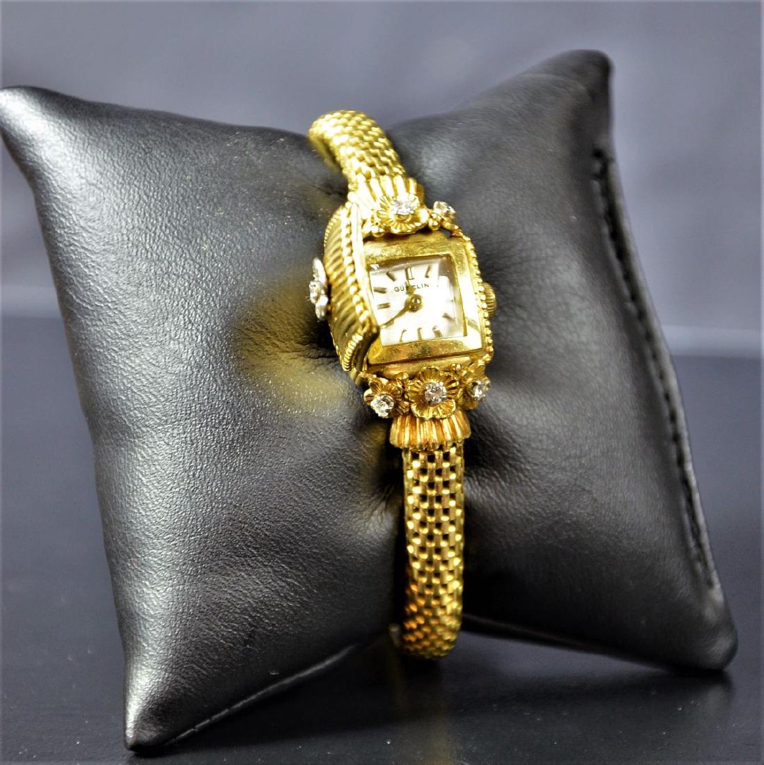 18ct (36 g) gold jewelry watch with diamonds GUBELIN. (1 of 2)