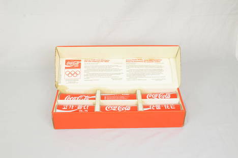 A set of 6 Coca-Cola cans from 1988 Olympics: A set of 6 Coca-Cola cans from 1988 Seoul Olympics in the original packaging. The cans feature unique illustrations of 6 types of sport disciplines typical for Korea. Average condition. Cans are