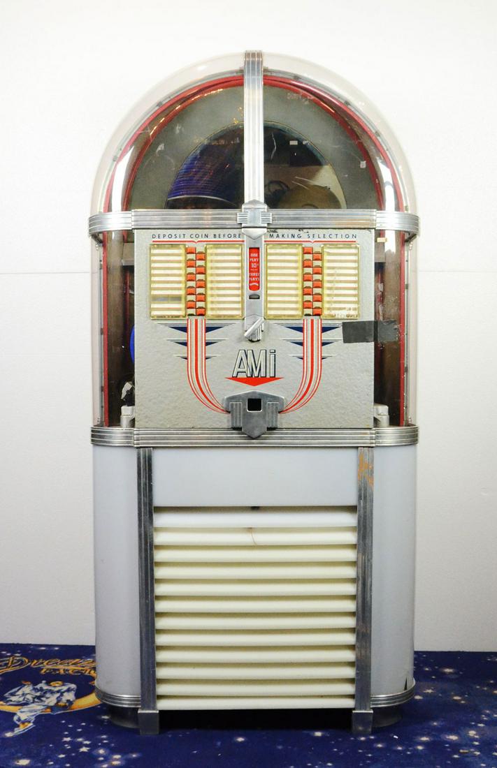 Juke-Box AMI 500, Model "C": Jukebox AMI 500 , Model "C" plays 45 rpm records, rotating lights in the base. In working condition. One of the lights doesn't rotate. Visually good condition. Back panel and front doors are held shut