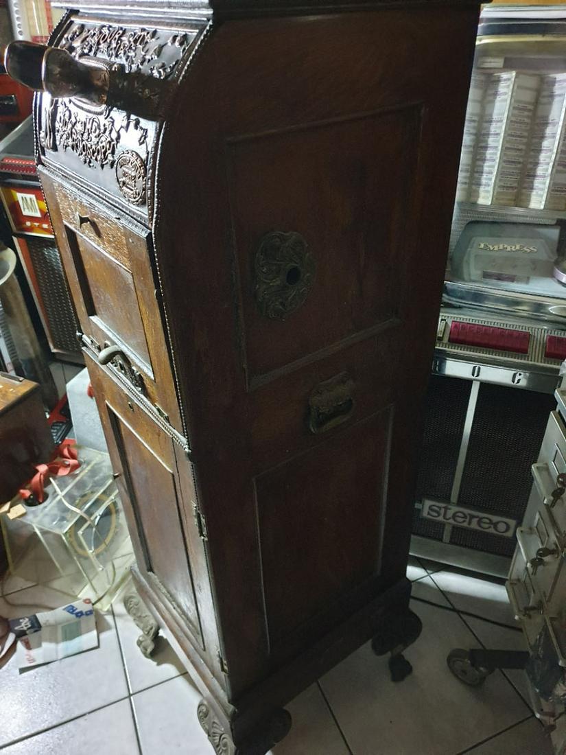 1897 "The Quartoscope" View Machine: 1897 Floor Model The Quartoscope "Peep Show" View Machine. 5 cent coin operated machine has a quartersawn oak case with front and side panels; cast iron handles mounted on each side and stands on cast