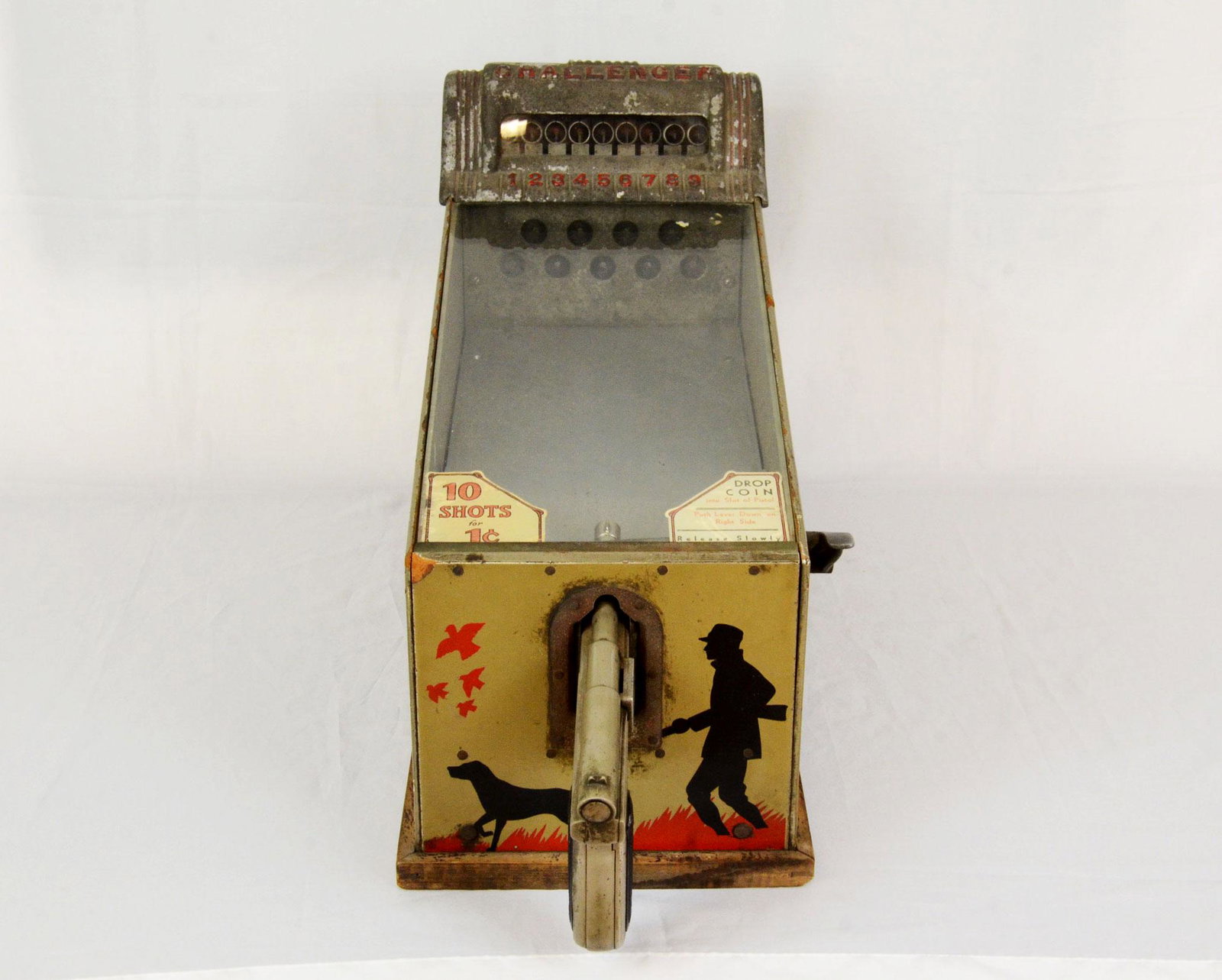 Challenger coin operated mechanical game: Challenger coin operated mechanical shooting game by A.B.T. Mfg Corp. Needs repair, accepts coins, but gun trigger doesn't move. Good visual condition with signs of use. Made in Chicago, U.S.A. 38 x 2