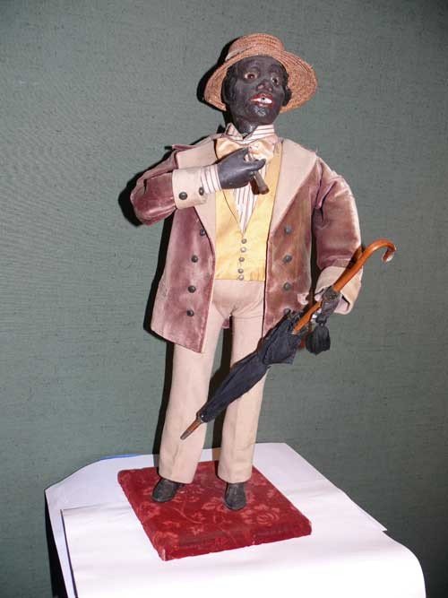 Elegant smoking Dandy by Vichy: Smoking standing man ,who smokes and holds a cane by VICHY .With music box. Mechanics, including the bellows are housed in the body of the character. Key wound. key hidden by the jacket. Redressed, Pa