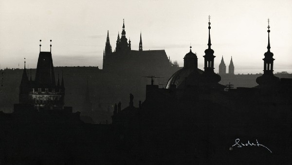 Sudek, Josef: Prague skyline at dusk: Prague skyline at dusk. 1960s. Vintage matte gelatin silver print. 21,2 x 37,5 cm. Signed by the photographer in white crayon in lower right corner; photographer's stamp, address Praha III, Ujezd 