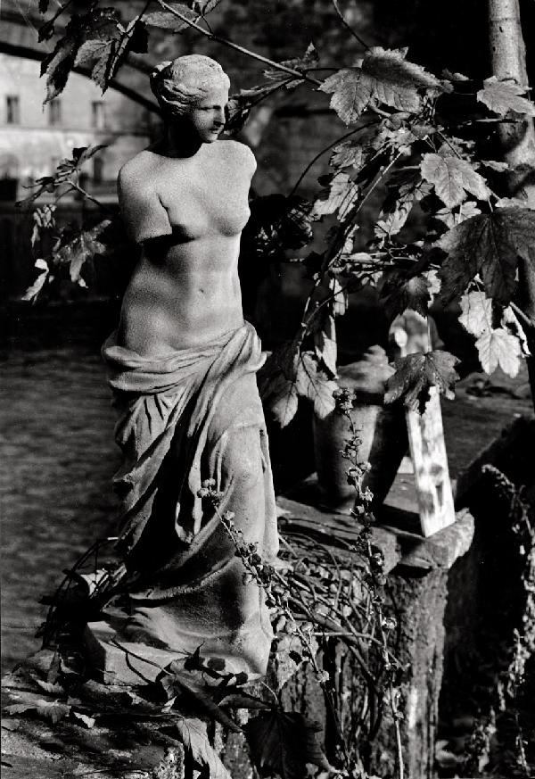 Sudek, Josef: Statue in Prague; Charles Bridge at: Statue in Prague; Charles Bridge at night. 1960s. 2 vintage ferrotyped gelatin silver prints on Agfa paper. 39 x 27 cm and 34,5 x 28,5 cm. First print signed by the photographer in pencil and photogra