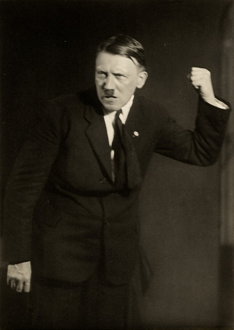 Hoffmann, Heinrich: Adolf Hitler: Six posed portraits of Adolf Hitler giving a speech. Circa 1927. 6 vintage gelatin silver prints (photo postcards) housed in an original paper folder (slightly faded, 1 repaired tear). Circa 11,5 x 8,