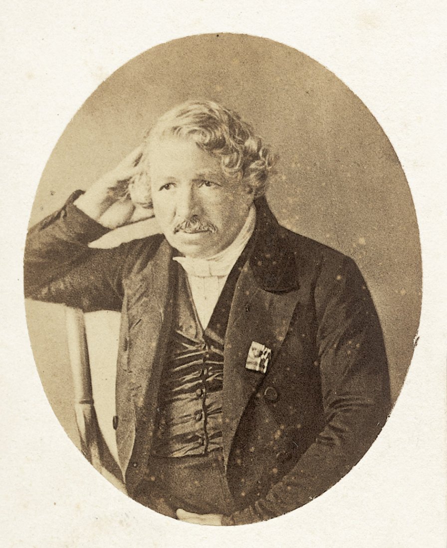 Daguerre, Louis Jacques Mandé: Portrait of Louis : Photographer: Mayer & Pierson (active 1850s-60s). Portrait of Louis Daguerre. Circa 1850/ printed late 1850s. Albumen print (oval). 6,2 x 5 cm. Mounted to original studio carte-de-visite (a few li