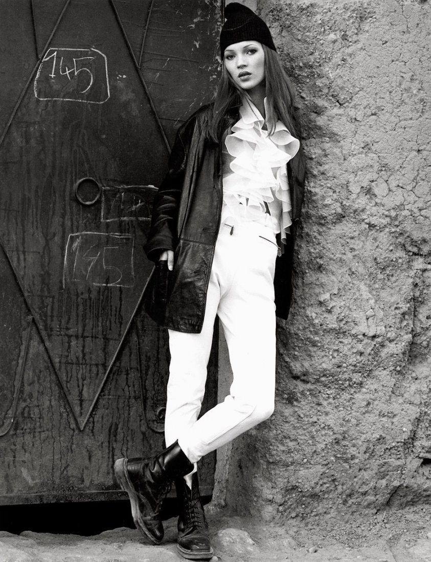 Watson, Albert: Kate Moss modelling fashion in Ma: Kate Moss modelling fashion in Marrakesh. 1993. 2 gelatin silver prints. Each 33 x 25,5 cm. Both photos slightly buckled on right side, some handling creases, otherwise in good condition. Provenance: 