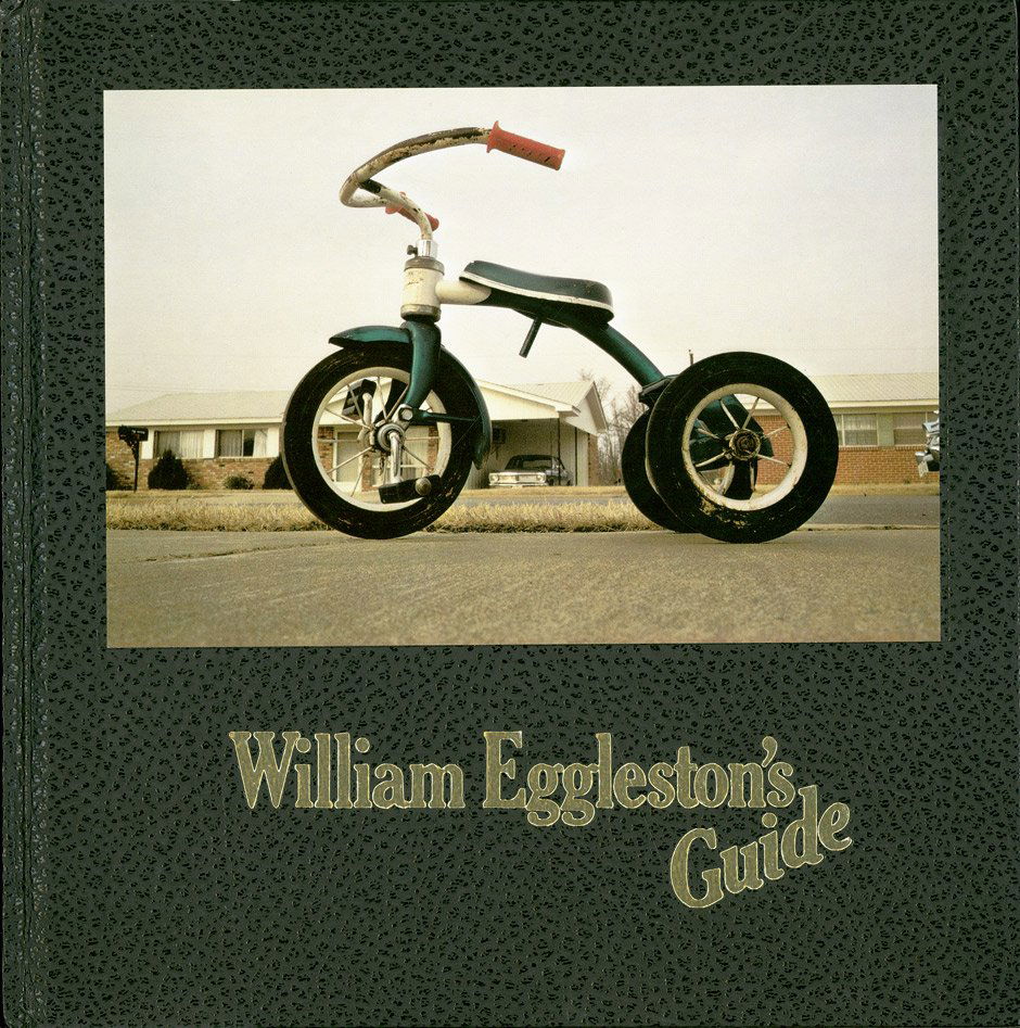 Eggleston, William: William Eggleston's Guide: William Eggleston's Guide. With a text by John Szarkowski. 110 p., 1 l. with numerous full-page color illustrations. 23.5 x 23.5 cm. Original black imitation leather covered boards with a tipped in ph