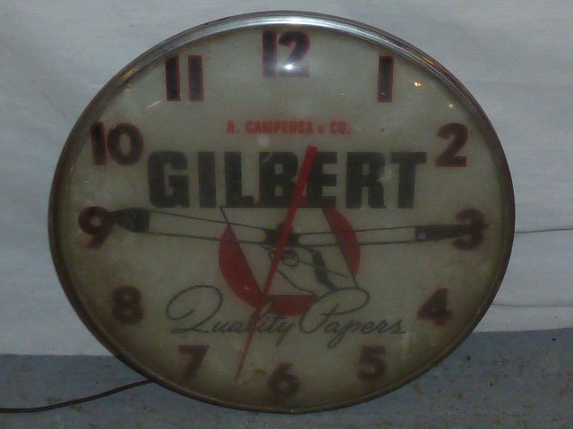 VINTAGE ADVERTISING CLOCK GILBERT QUALITY PAPERS: SHOWING A VINTAGE ELECTRIC ADVERTISING CLOCK . A. CAMPENSA & CO - GILBERT QUALITY PAPERS . WORKING CONDITION . MEASURES 15" ROUND . AS FOUND ESTATE CONDITION.PLEASE USE PHOTOS AS PART OF THE DESCRIPTI