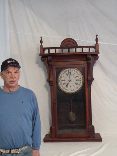 ANTIQUE WALNUT CASED REGULATOR CLOCK: SHOWING A ANTIQUE WALNUT CASED REGULATOR CLOCK , ORIGINAL DIAL WITH SECOND HAND . MEASURES 49" TALL ON A 28" BY 8 1/2" BASE . AS FOUND ESTATE CONDITION.PLEASE USE PHOTOS AS PART OF THE DESCRIPTION. TH