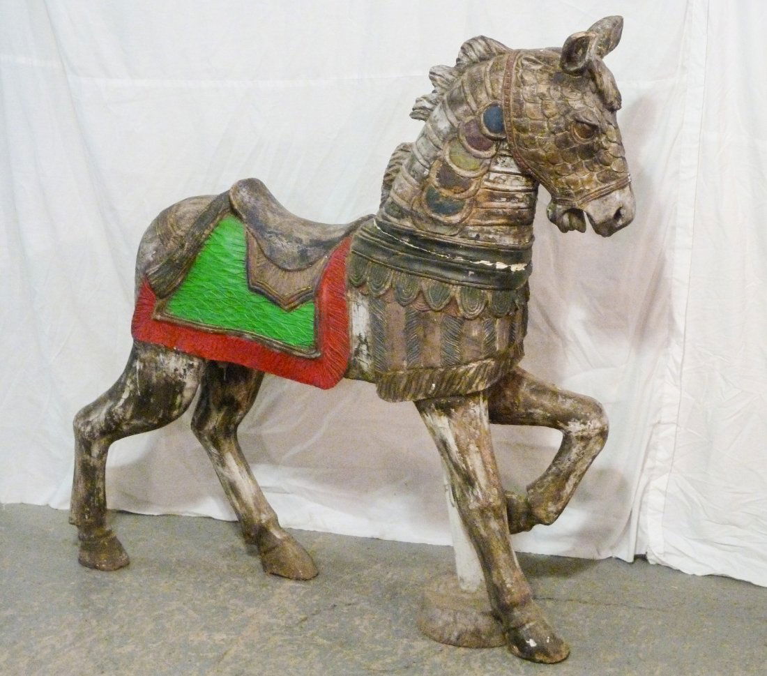 Carousel Carved Wood Horse: Fedual caparison carving . Older repaint . On stand. Measures 50" x 49 1/2" x 12" . One of two in this sale , other carousel horse is lot 81. As found estate condition . Please use photos as part of t