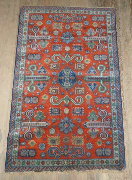 Persian scatter rug, double border red field: Geometric and star design along border. Measures 60" x 37". As found estate condition . Please use photos as part of the description. The absence of a condition report does not guarantee excellent con