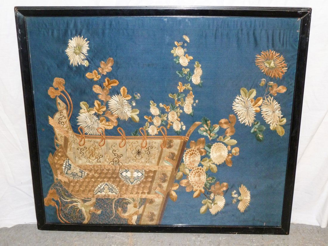 Antique Chinese Embroidery Silk and Gold Thread: Flowers flowing from a delicately done cart with fighting fish at base.Wavy glass from the period , has a three dimensional quality to the embroidery panel. Measures 35" wide and 31" tall. As found es