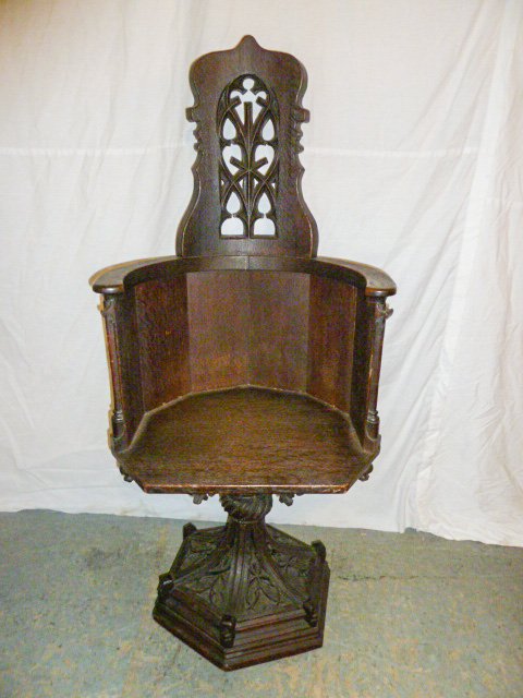 Period Architectural Gothic Swivel Base Desk Chair: Heavely carved back, base, and underneath seat. Measures 52" tall x 22 " wide and 18" deep seat. As found estate condition . Please use photos as part of the description. The absence of a condition re