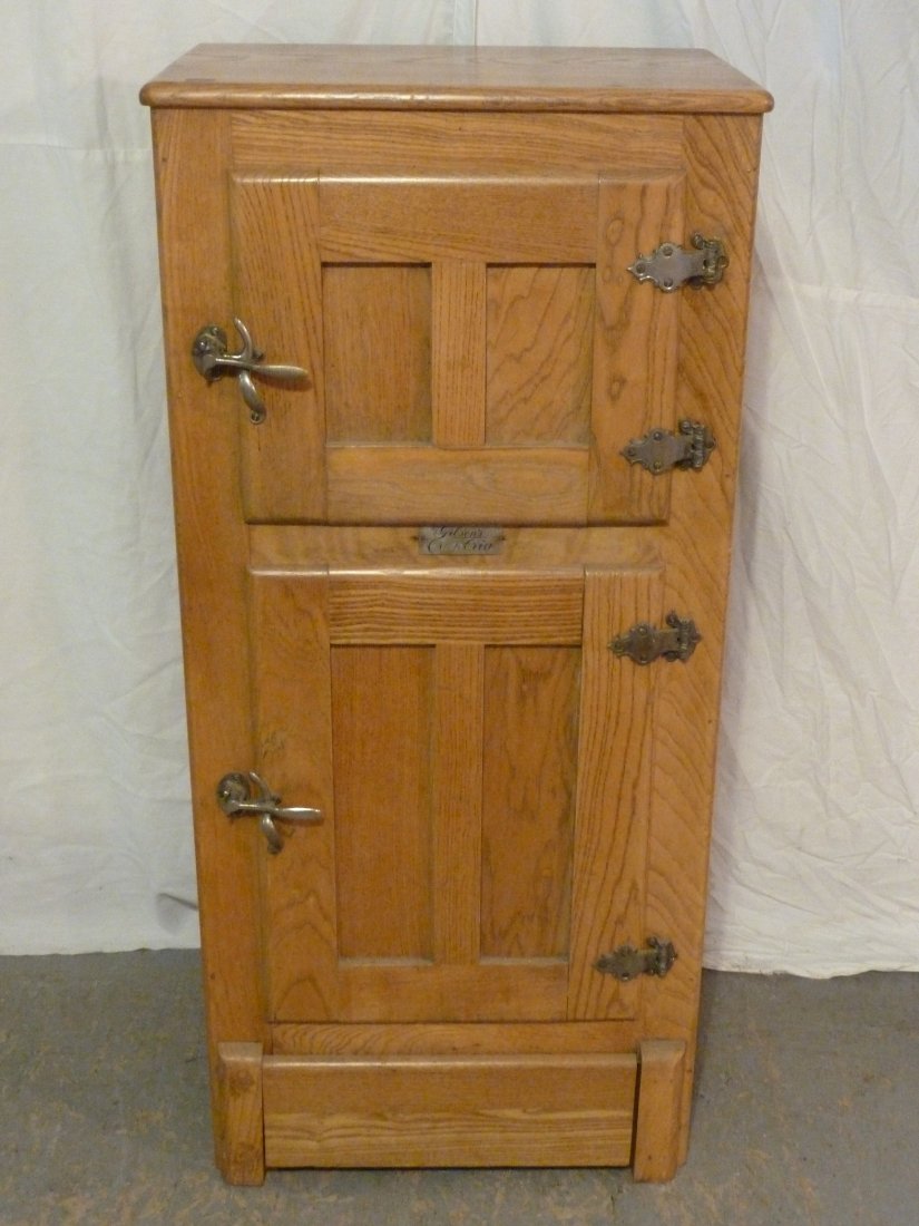 1900's Gibsons Cambria Oak Narrow 2 Door Ice Box: Recessed paneled sides and doors . Original hardware. Measures 48 1/2" tall 23" wide and 15 1/2" deep. As found estate condition . Please use photos as part of the description. The absence of a condit