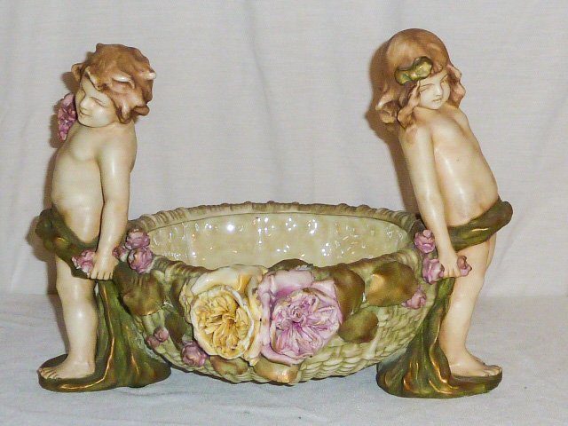 Teplitz Compote w/ Children on Sides: Amphora /Austria signed on bottom. 14" wide x 9 3/4" tall. As found estate condition . Please use photos as part of the description. The absence of a condition report does not guarantee excellent cond