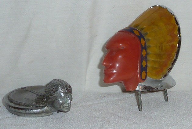 2 Indian Head Radiator Cap, Hood Ornaments: One is a 1928 Pontaic Radiator/ hood ornament and the other is a 1950's Buick Super Chief Hood ornament that illuminates when wired. Made by the BlackStone Mfg. Measures 4 1/2" x 4" . As found estate 