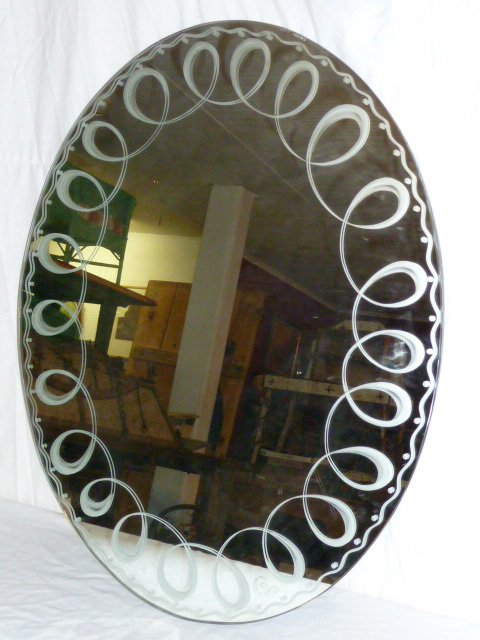 Moderne Oval Shaped Mirror Scalloped Border signed CV: Measures 30" by 24" . We have lovely bowl in the sale lot 163 signed on the base CV. As found estate condition . Please use photos as part of the description. The absence of a condition report does no