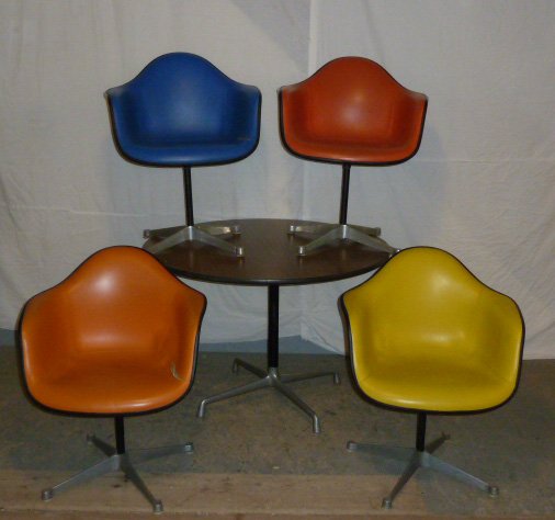 1960's Herman Miller Design by Knoll Dining Set 4: Round table top measures 42" across and 28 1/2" tall.. Chairs in multi-colored measures 32" tall by 25" wide and 16" deep, some wear splits to the chairs. As found estate condition . Please use photos