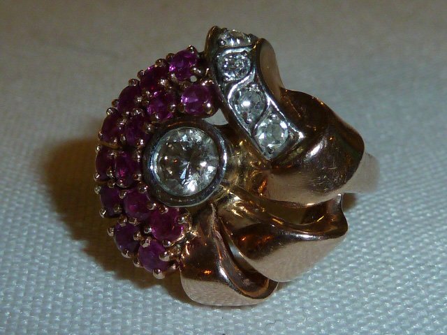 Antique Art Deco Pink Gold Diamond & Rubies Retro Ring: 14kt pink gold flower form ring with two curved rows of 14 individual rubies and 4 small side diamonds together with a nice size center diamond stone make up the perfect Art Deco Retro Ring. White gol
