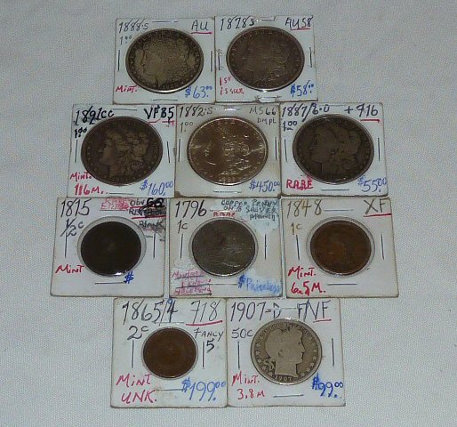 10 Antique Coins in Lot: Morgans , 1796 Copper Penny: Five Morgan silver dollars 1882s etc. 1907 1/2 cent , 1848 1cent 1865/4 2cent coin 1815 1/2 cent coin. As found estate condition . Please use photos as part of the description. The absence of a condit