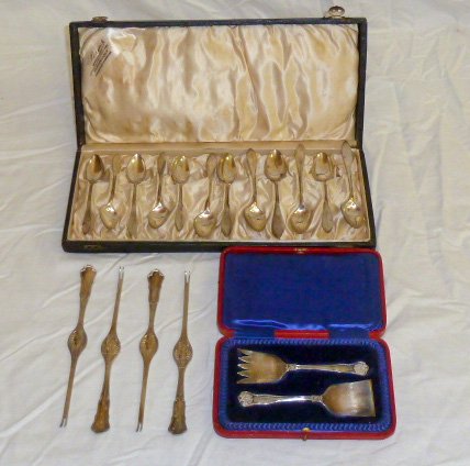 Circa 1900's Silver Lot" Lobster Picks Etc.: Showing detail closeups. Four Lobster Pics 800 silver. Boxed set of twelve sterling spoons and a fabulous boxed fork and spoon set. As found estate condition . Please use photos as part of the descrip