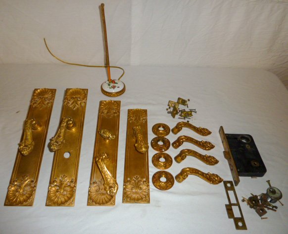 Compilation of Victorian Bronze Hardware: Incredible lot of antique bronze hardware for period doors plus addition of bronze and porcelain butler call. Four matching door plates one with lock , eight matching door handles, 4 matching rosettes