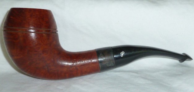 Peterson Sherlock Holmes Deerstalker Unsmoked: Peterson's : Silver Band - Smooth briar - P-Lip Made in Ireland . One of 50 estate pipes in this sale . Measures 6" . As found estate condition . Please use photos as part of the description. The abse