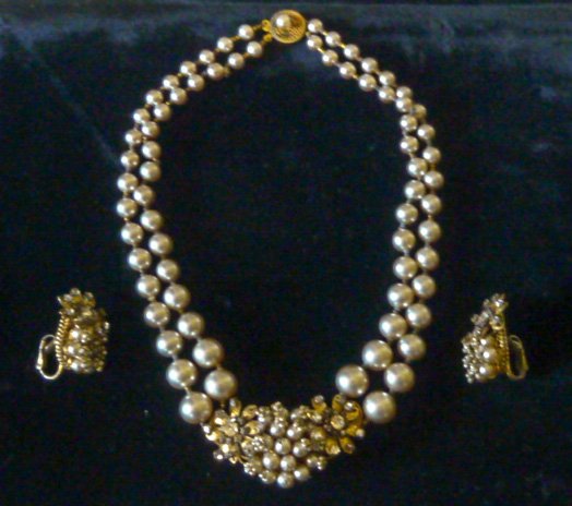 Vintage Miriam Haskill Faux Baroque Pearl Suite: Double strand pearl necklace with 2" pendant and pair of matching earrings. Necklace measures 15" long . Faux Baroque pendant measures 2" wide . Earrings 1 1/4" by 3/4" Both necklace and earrings are 