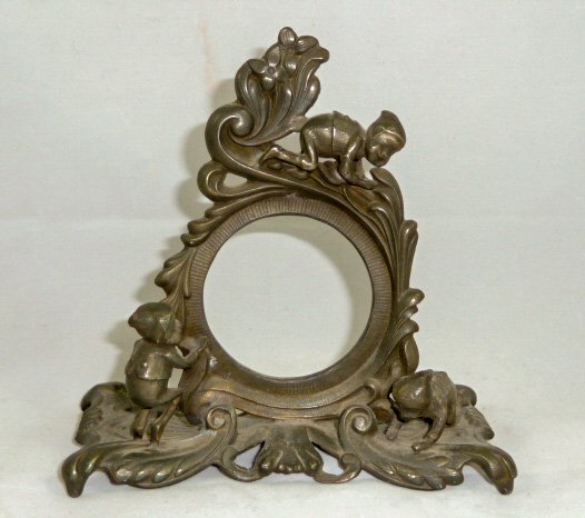 Pocket Watch Holder Palmer Cox Brownies: Dresser top Pocketwatch holder decorated with Elves / Brownies playing on Vine.The WATCH IS NOT part of this lot, just for display. The watch is in the sale and the watch is selling: LOT 107. Measures