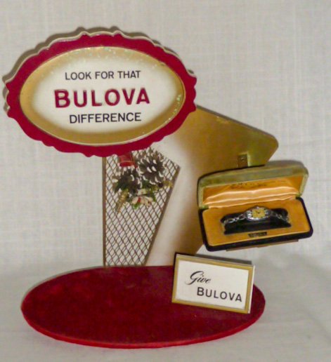 Bulova Watch Store Display for Christmas Holiday: Scarce Bulova store counter display is from 1950's - 60"s. Measures 14 1/2" wide by 13 1/2" tall and 6 1/4" deep. As found estate condition . Please use photos as part of the description. The absence 