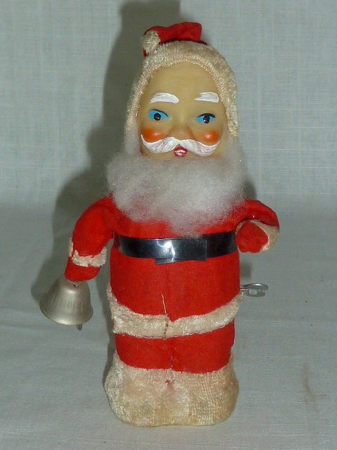 1950's Wind-up Santa Claus Ringing Bell Toy: Vintage Santa Claus wind-up toy moves around in a circle while he rings out on his bell Christmas Cheer !!! Clean and bright colors. Fine working condition. No damage, measures 7" tall. As found estat