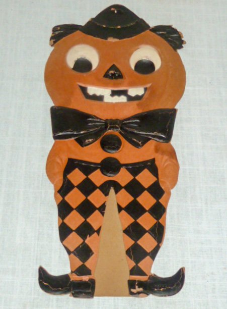 WWII Vintage Halloween Die Cut Jack-O-Lantern Germany: Halloween Jack O Lantern With Easel Back measures 21” Tall . This Scary Jack O Lantern “Clown” is Half Human and Half Pumpkin and dressed as Clown . Back is printed Made in Germany USSR Occupied