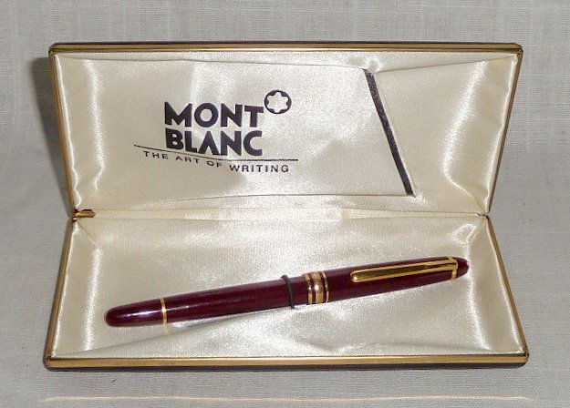 Vintage Mont Blanc Meisterstuck Pen in Orig. Box: Ball point pen is a warm colored Maroon with gold color trim. Measures 5 1/4" closed 6" opened. As found estate condition . Please use photos as part of the description. The absence of a condition rep