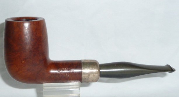 Peterson Pipe Dublin With Sterling Silver Band Unsmoked: Peterson's Smoking Pipe, Dublin with Wide Sterling Silver Band Measures 5 3/4Â” Systems Standard, Smooth Briar Made In Ireland. Unused. As found estate condition . Please use photos as part of the 