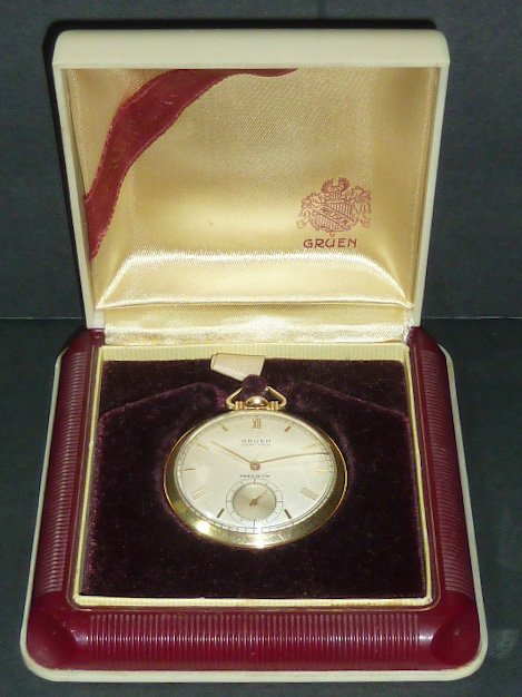 Gruen Very-Thin Pocket Watch in Original Display Box: Seventeen Jewels , Gold filled Wadsworth case. Measures 1 3/4” diameter. Clean , running condition. As found estate condition . Please use photos as part of the description. The absence of a conditi