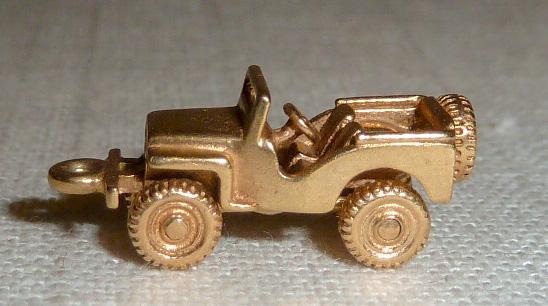 14kt 3D Movable Articulate Military/Off Road Jeep Charm: One of over two dozen Three Dimensional , Movable , Articulate 14kt Gold charms in this sale. The Jeep charm rolls right along , nothing stands in it's way..... Measures 13/16” long and 2.3 dwt.