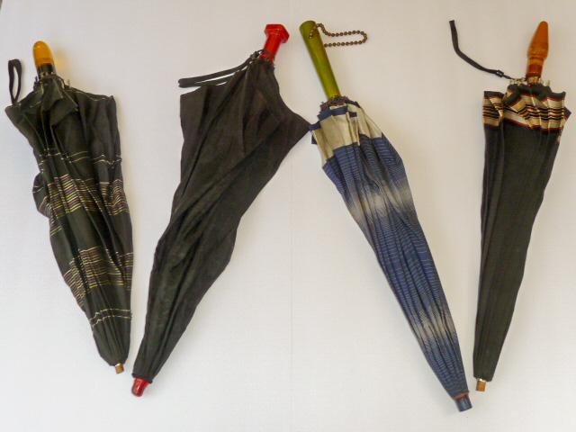 Vintage Bakelite handle Umbrellas: Vintage lot of Four Fabulous Umbrellas Handles are Cherry Red, Swirl Green and Apple Juice. Two Fabric good two Fabric with tear. Handles are Great. As found estate condition . Please use photos as pa