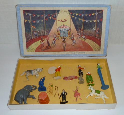 Charbens Circus Boxed Set of Lead Circus Performers: Charbens toys , world wide series , made in England.The boxed set comes with 12 pieces: Ring Master - Clown with dog - Lady horseback rider and horse - Clown on unicycle - Elephant with stand - Clown 