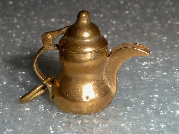 18kt 3D Movable Articulate Water Pitcher Charm: One of many three dimensional , movable , articulate 14kt Gold charms in this sale. Water pitcher with movable lid charm ..... Measures 3/4” tall and 2.0 dwt. As found estate condition . Please