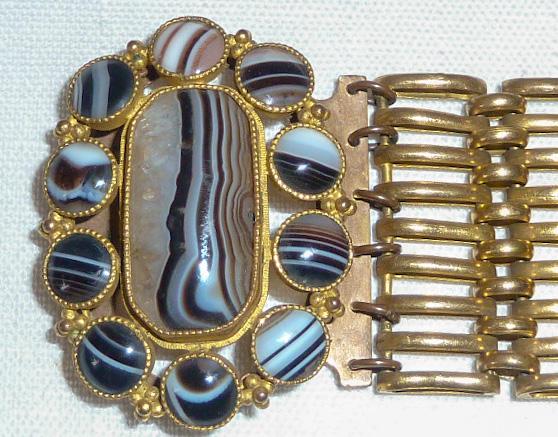 Antique 1930's Beautiful Linked Bracelet with Agate: Extraordinary Antique Bracelet measures 8” long and 1 1/2” wide. Bracelet appears to be hand made with hand set Agate stones creating a large center piece measuring 2” which hides th