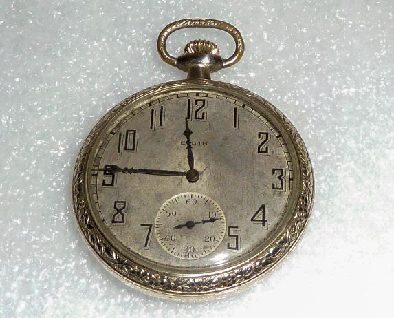 14kt G.F. Pure Art Deco Elgin Open Face Pocket Watch: 1924, size 12s, movement finish Nickel, 3/4 plate, Breguet hairspring, single-sunk dial, Arabic numbers, not monogramed. Running… Great every day use pocket watch. As found estate condition . Pl