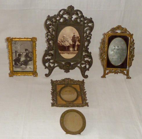 Five Antique Picture Frames: Antique Picture Frames. There Are Five Picture Frames In This Lot. First Is Large Iron Victorian Ornate Frame detailed with Winged Cherub . Frame Measures 11” by 8” and is very Heavy. This