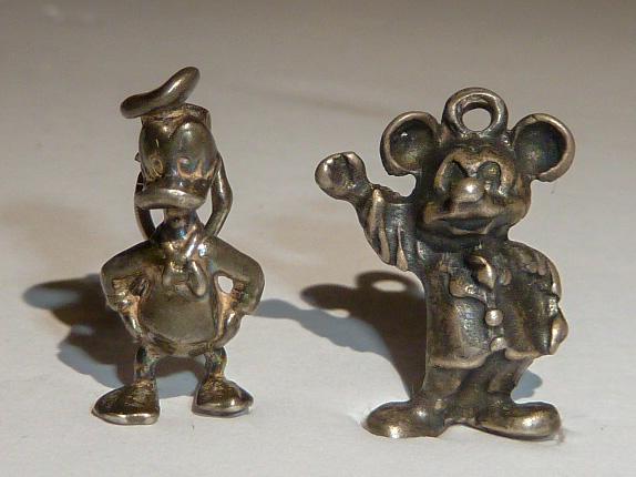 Walt Disney Sterling 3D Charms Mickey & Donald: Vintage sterling silver Disney Donald and Mickey Mouse bracelet charms . There are other Disney sterling charms in this saleâ€¦. As found estate condition . Please use photos as part of the descri